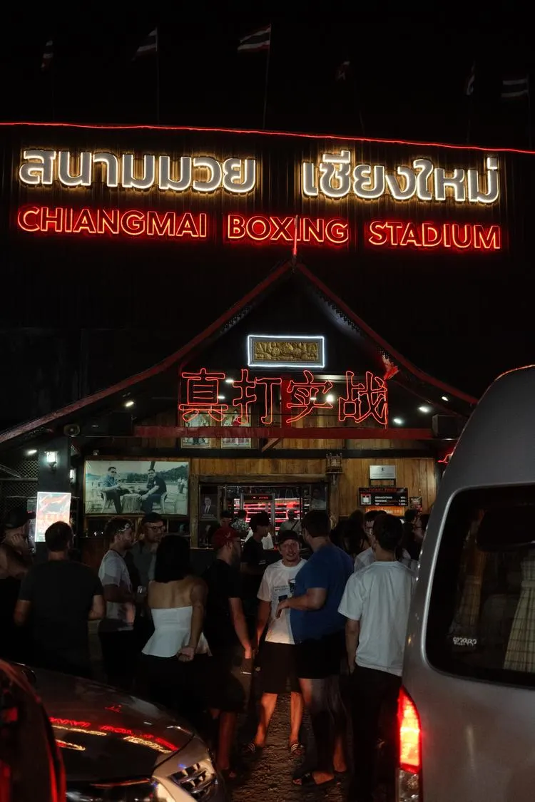 Portrait view of a lively restaurant entrance at night